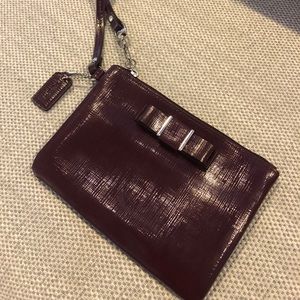 COACH - maroon wristlet with bow